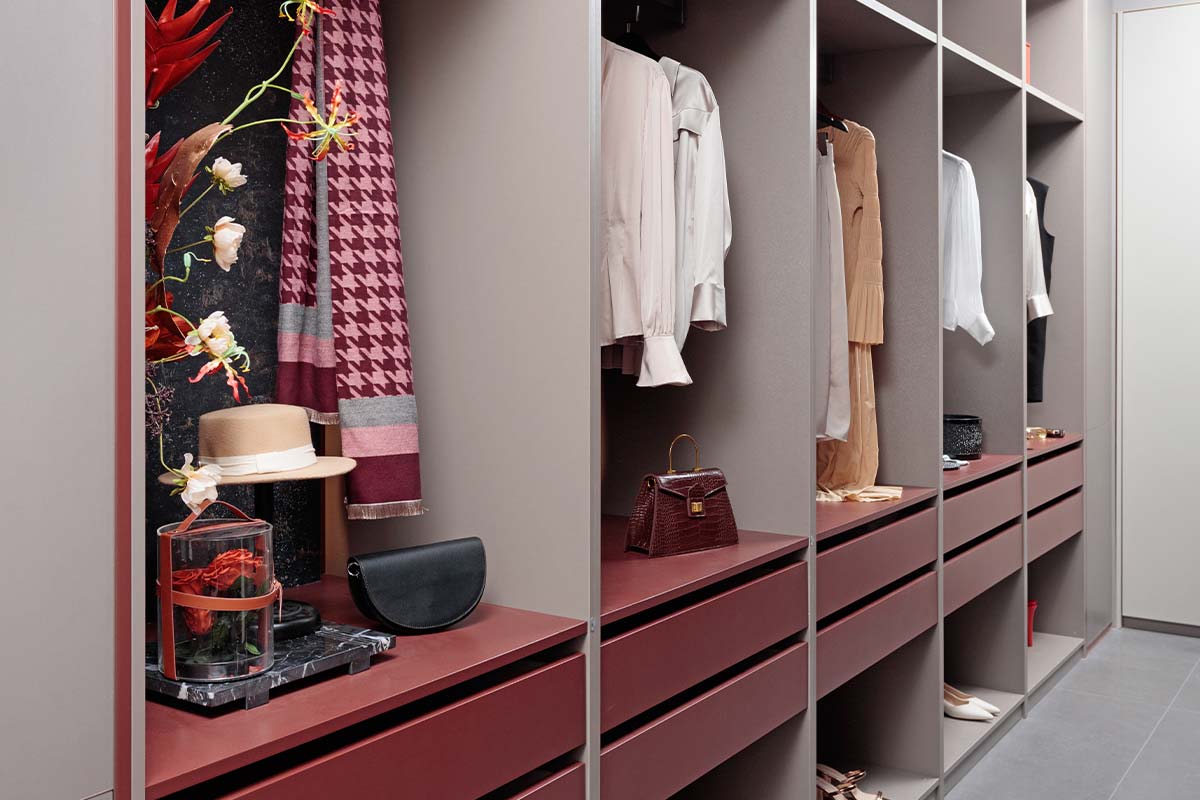Fitted Light Grey and Red Walk in Wardrobe